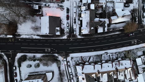 Top-down-static-aerial-of-street-in-town-of-Newcastle-after-december-snow