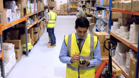 Worker-checking-barcode-scanner