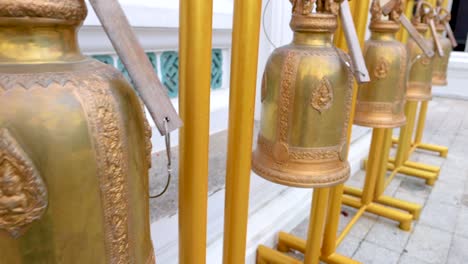 close-up of golden bells at prayurawongsawas temple in bangkok, thailand