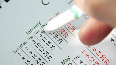 Detail-shot-of-a-calendar-on-table,