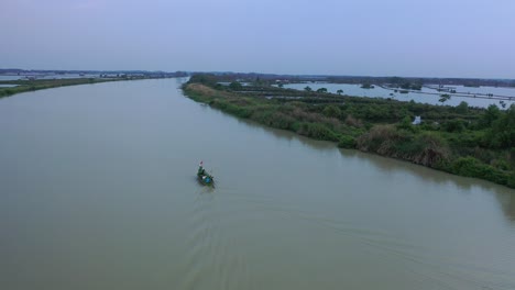 boat on a canal in rural landscape