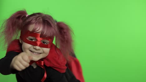 little girl dressed as a superhero