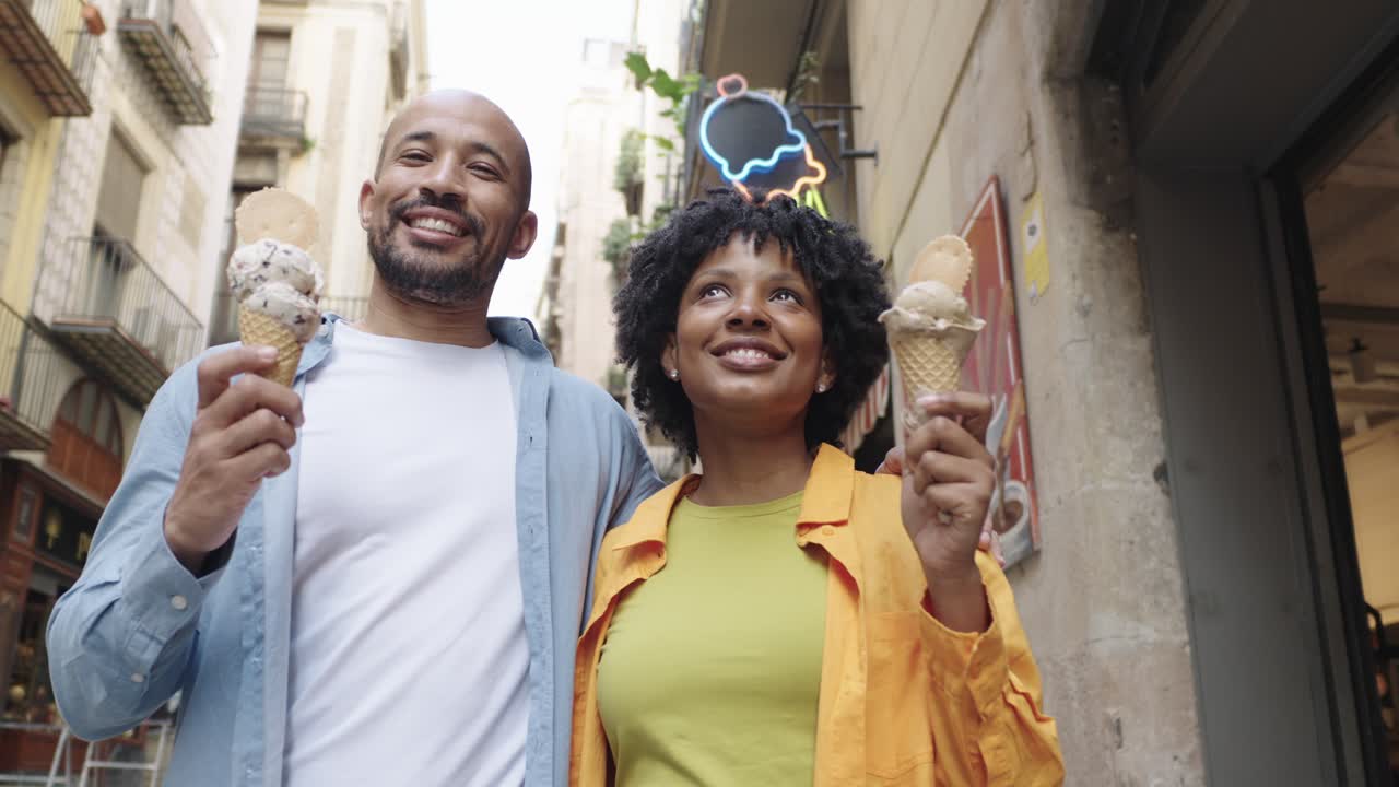 Couple enjoying ice cream on the street