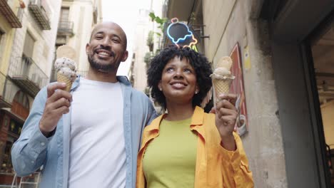 couple enjoying ice cream on the street