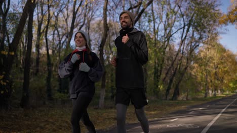 couple running in autumn park