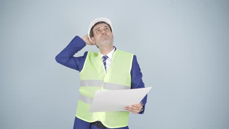 looking up, the engineer is holding his hard hat.