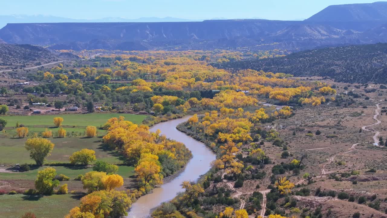 Serene view of Rio Chama with fall foliage in Abiquiu, New Mexico