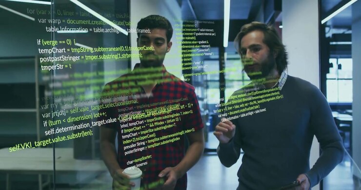 Two software developers walking, code overlay appearing on glass, causing tablet-guided review