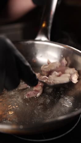 cooking chicken in a pan