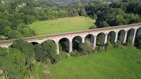 Chirk-railway-Viaduct---aerial-drone-reverse-and-anti-clockwise-rotate,-revealing-countryside---Welsh,-English-border,-Sept-23