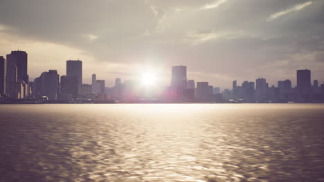 urban skyline under a golden sunset with reflections on calm water