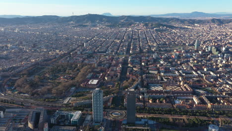 Aerial-large-view-of-Barcelona-Olympic-Village-of-Poblenou-district-mountains