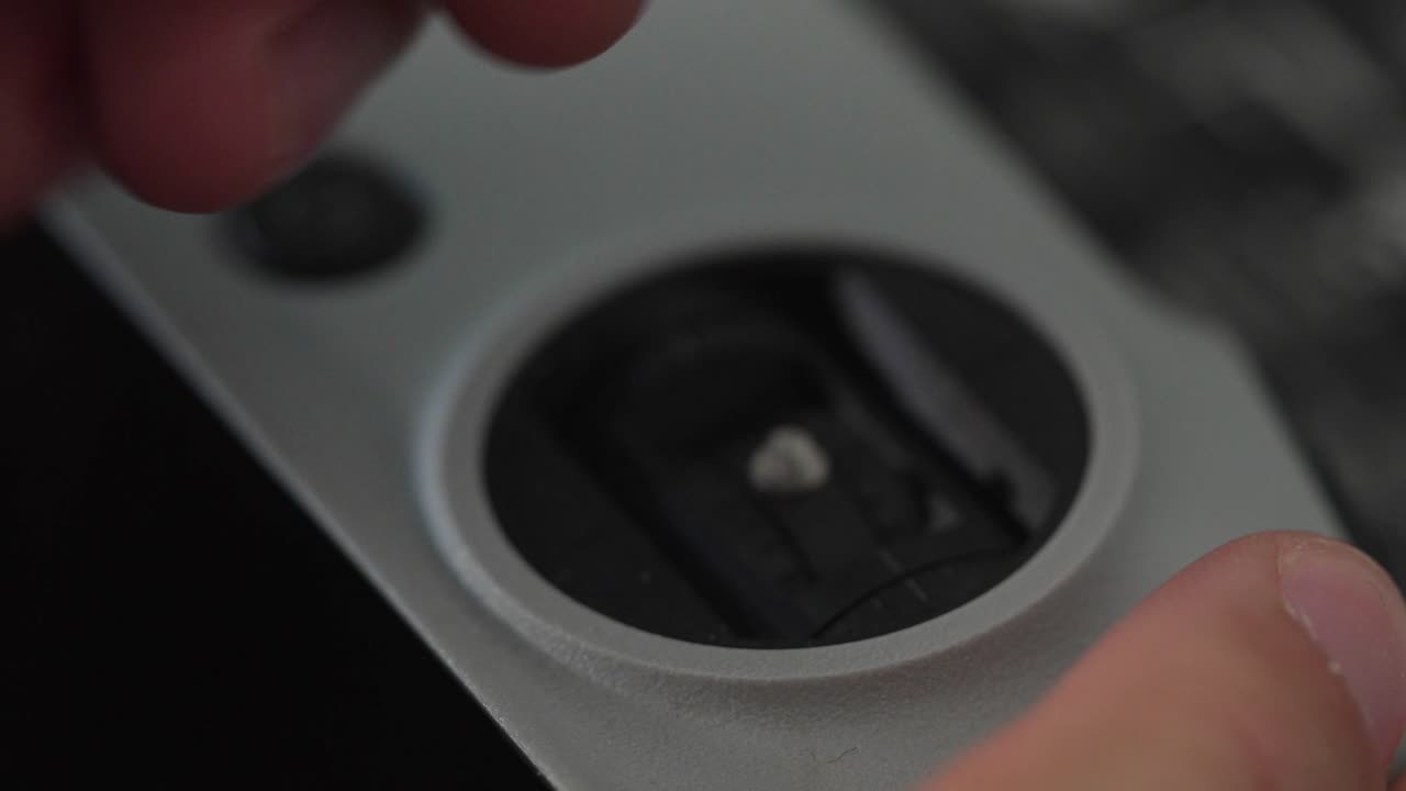 Close Up Shot of Hand Removing Joystick From Drone Controller