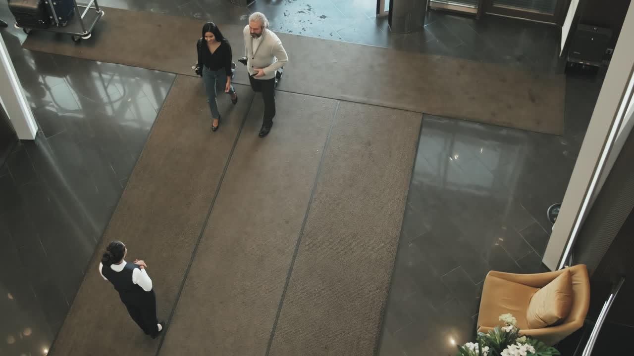 Couple Arriving in Posh Hotel