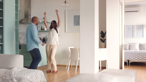 Dance,-home-and-happy-couple-dancing-to-celebrate