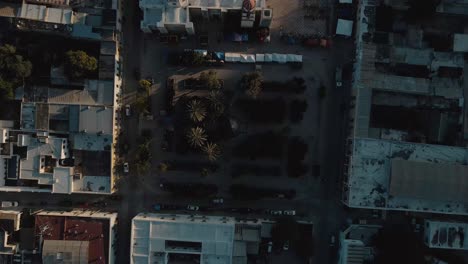 Aerial-view-of-a-Mexican-town-square-with-palm-trees-at-dusk