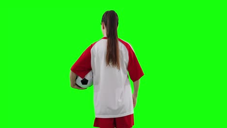 Video-of-back-view-of-caucasian-female-football-player-with-football-and-copy-space-on-green-screen