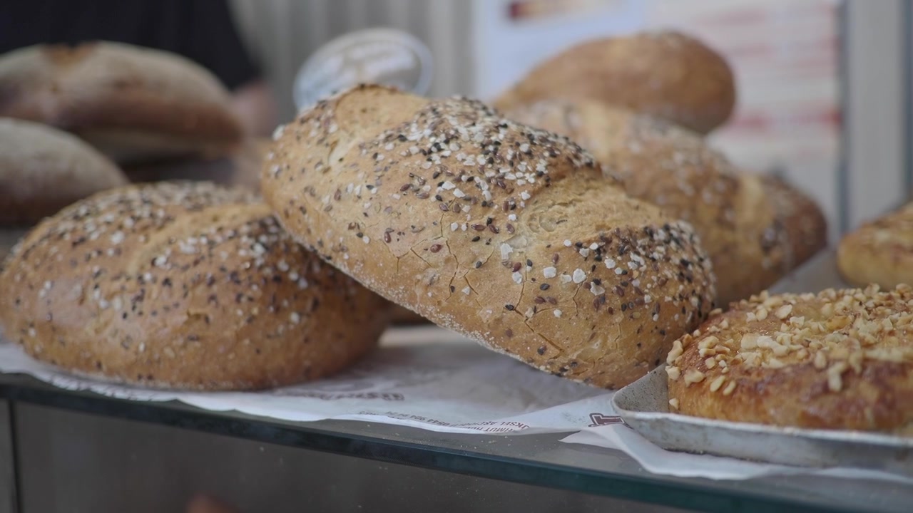 Freshly Baked Artisan Bread Loaves Displayed in a Bakery