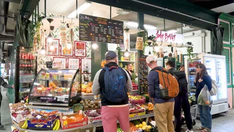 group of tourists exploring a vibrant food market