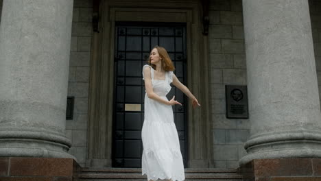 ballet dancer in front of a building
