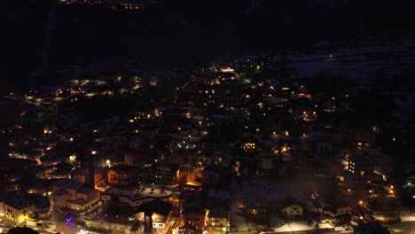 the roads are magical, but seen by a drone over the mountain with illuminated lights show the beauty of the olympic site in italy cortina 2026. in winter games