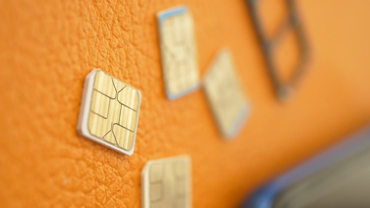SIM Cards on Orange Surface