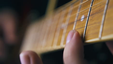 skilled musician plays acoustic guitar nylon strings closeup