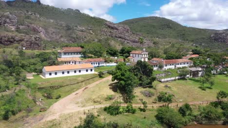 Row-of-an-old-building-with-a-backdrop-of-barren-hills