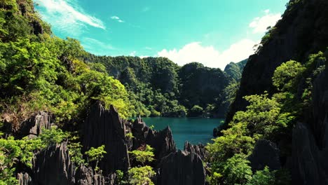 4k-Drone-Closeup-To-Karst-Enters-Barracuda-Lake,-Coron,-Palawan,-Philippines