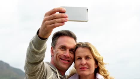 mature couple taking a selfie from mobile phone