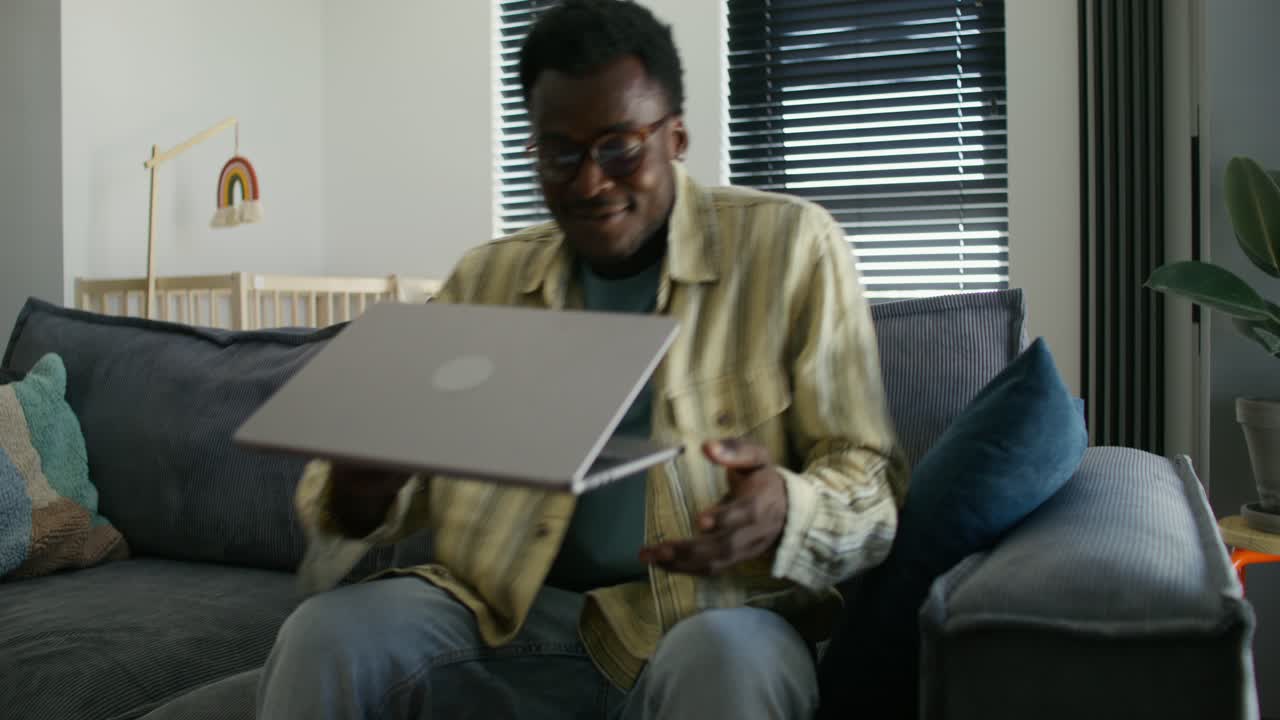 Man working on laptop at home