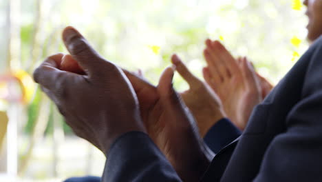 Close-Up-Of-Delegates-At-Business-Conference-Applauding-Speaker