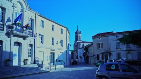 small empty square in boulbon in france with small village church