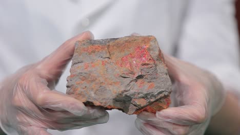 scientist examining a rock sample