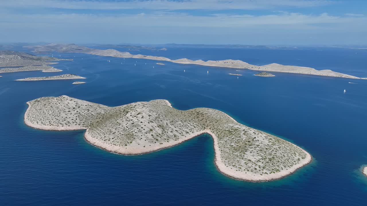 Aerial orbit over one of the many islands in the Kormati region, Croatia.