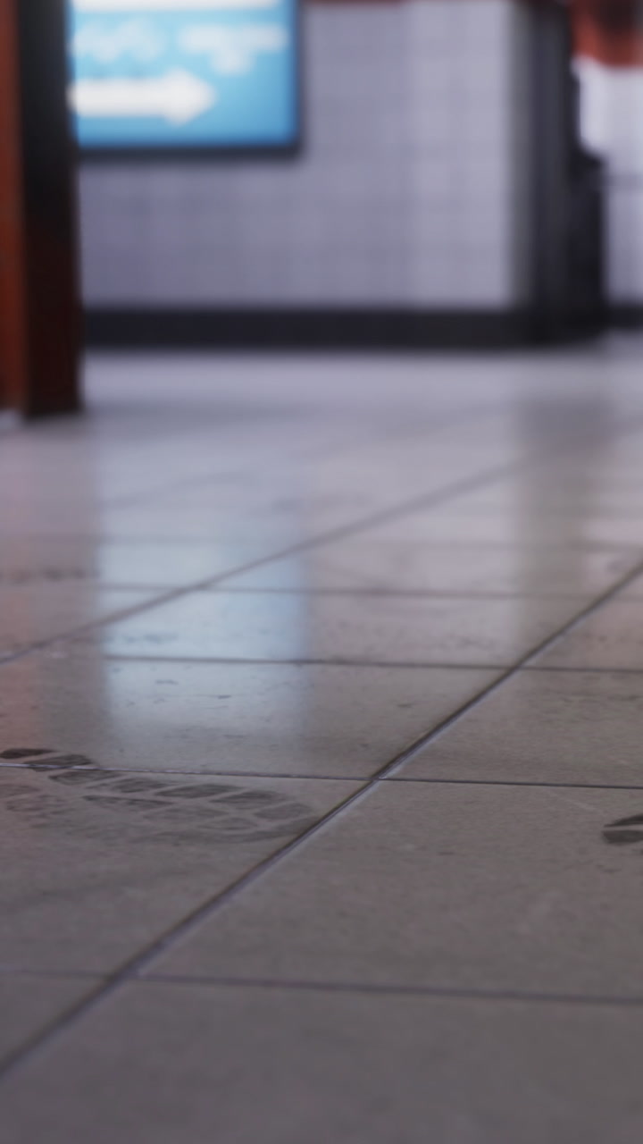 Exploring the intricate designs on tiled floors of an urban building