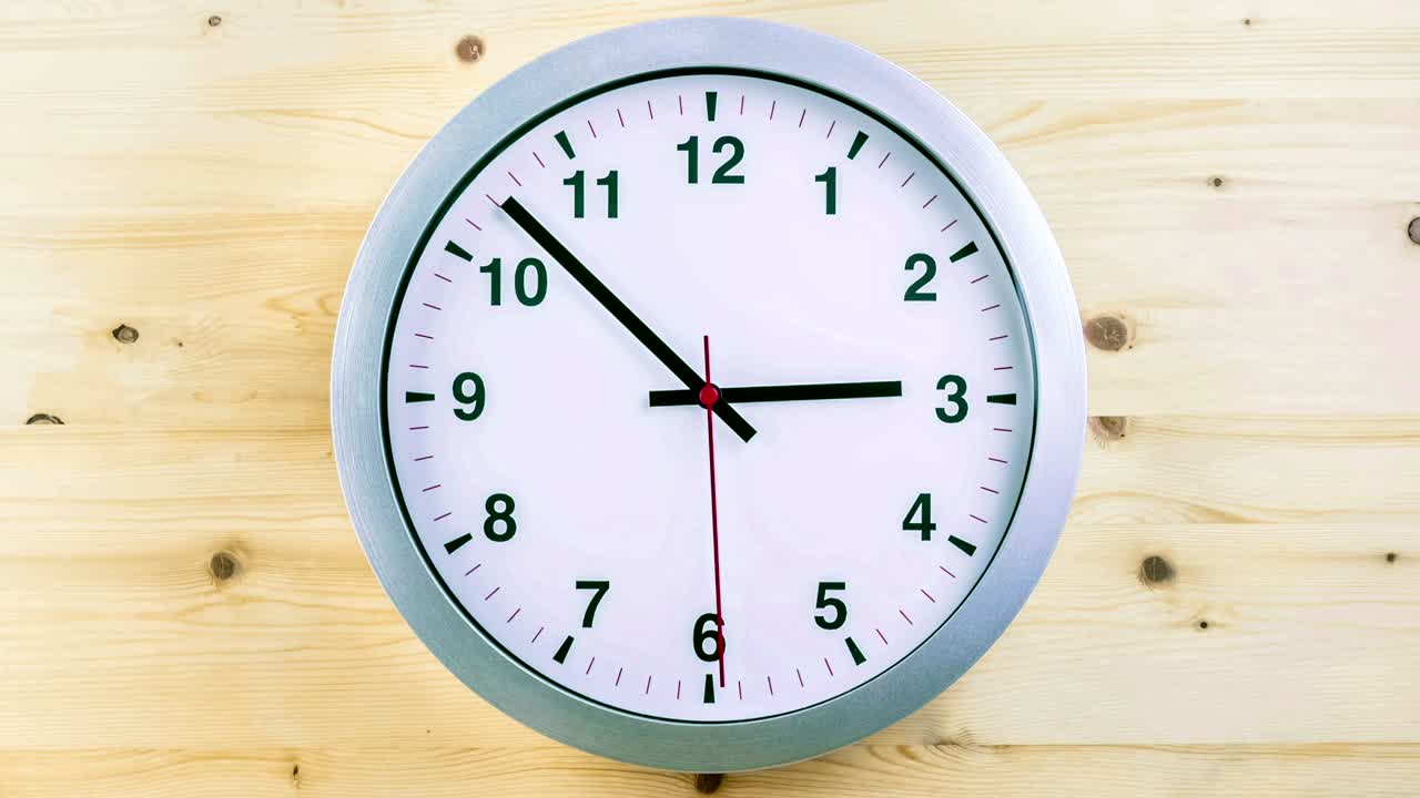 h24 hours timelapse seamless loop ready, clock hands movement, modern white metallic alarm wall clock on wood