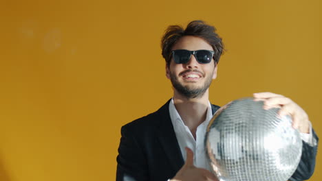 man with disco ball