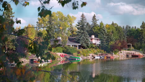 calm lakeside view of homes on a mild summer day in canada