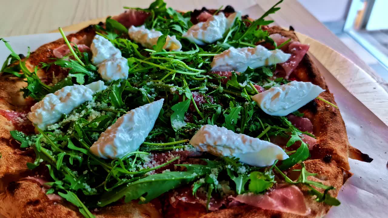 Italian-style Pizza With Fresh Greens And Cheese. - zoom in shot