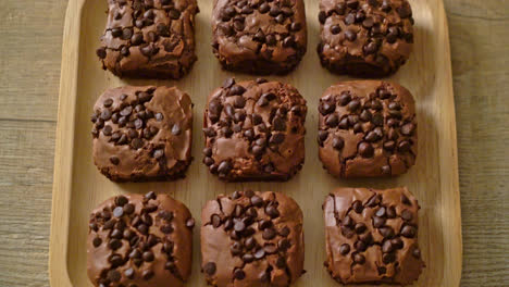 dark chocolate brownies with chocolate chips on top