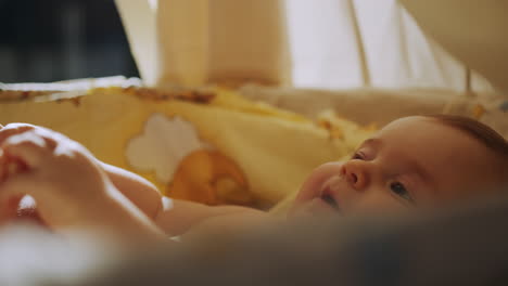happy baby in a crib