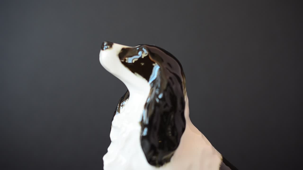 Shooting of a figurine of a spaniel. Shooting of a figurine