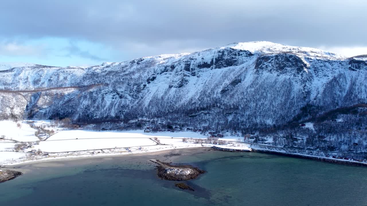 This 4K aerial video captures the winter magic of Bodø, Norway. Snowy mountains, frozen fjords, and Arctic landscapes create a mesmerizing winter wonderland.