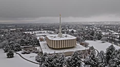 aerial orbit around provo lds mormon temple covered in snow view out to utah lake