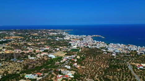 beautiful landscape of the beach and coast with its beautiful buildings of chania in crete greece with aerial view taken with a drone.