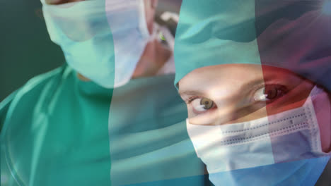 Animation-of-flag-of-italy-waving-over-surgeon-in-operating-theatre