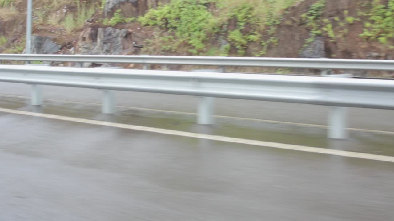 Metal Guard Rails in Expressway driving fast drivers point of view