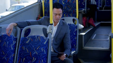 business commuter using mobile phone while travelling in bus 4k