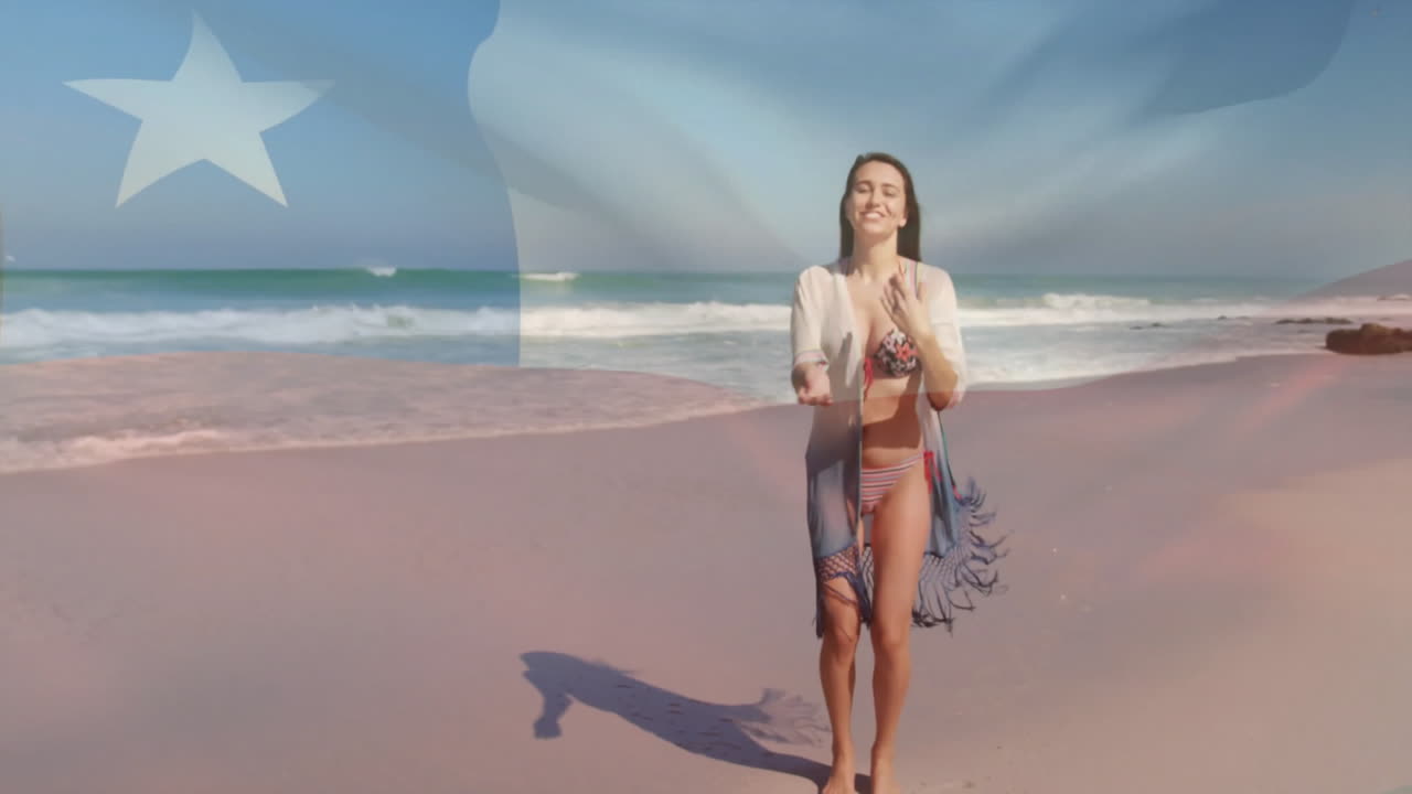 Walking on sandy shore, woman in beachwear with ocean waves in background